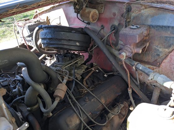 Inside the hood of an old truck.